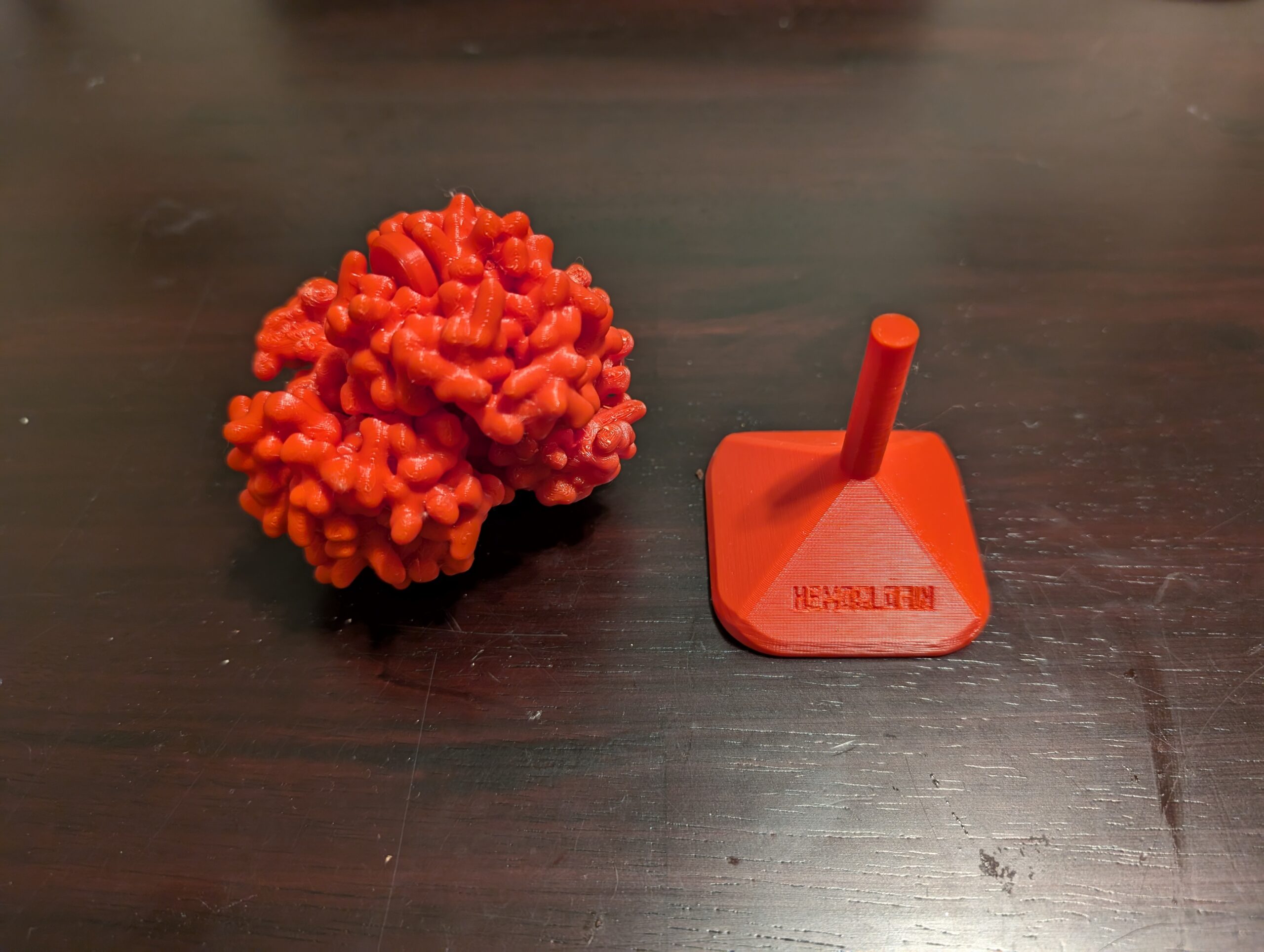 3D printed version of a molecule next to a stand