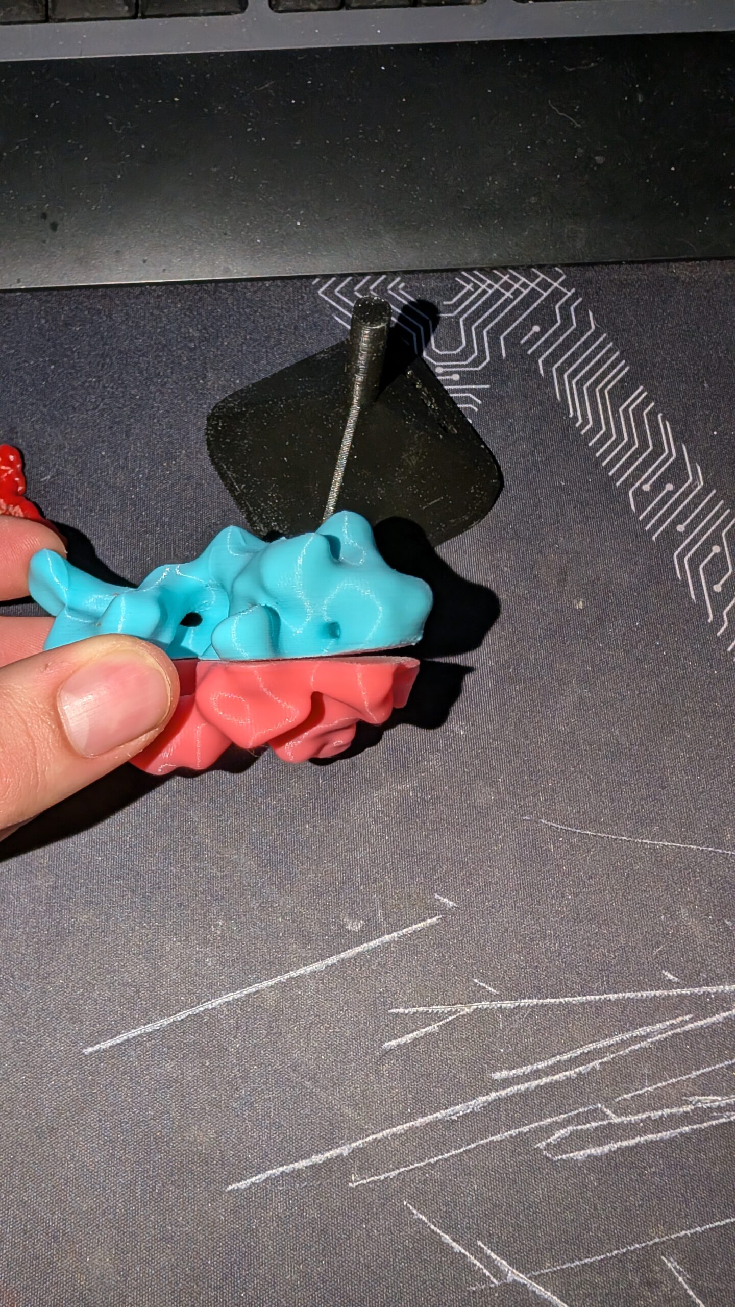 two halves of a 3D printed molecule being held together