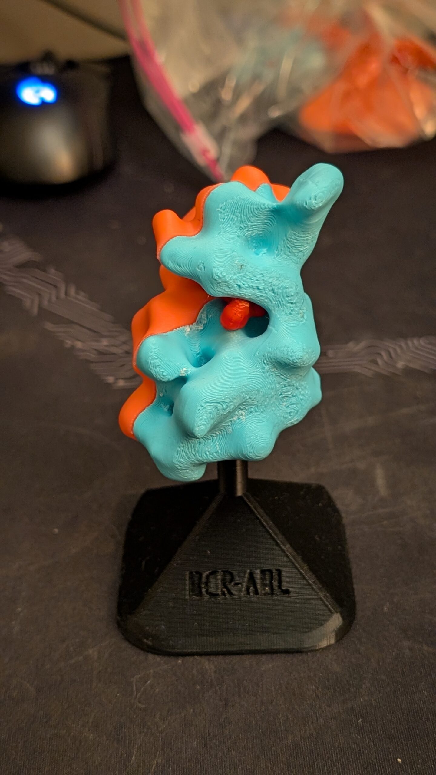 3D printed molecule in various colors demonstrating how molecules interact